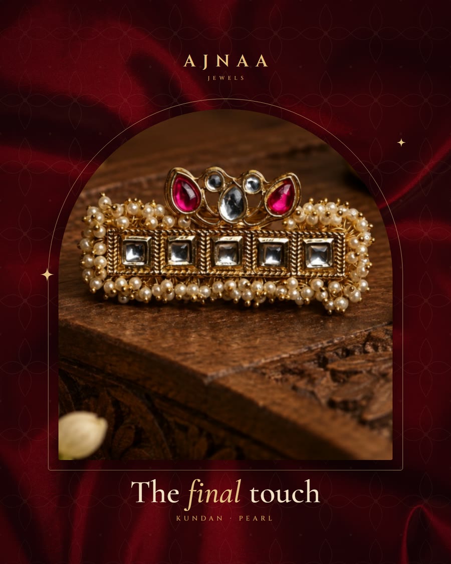 Feed post: The final touch, a kundan hair ornament on carved wood.