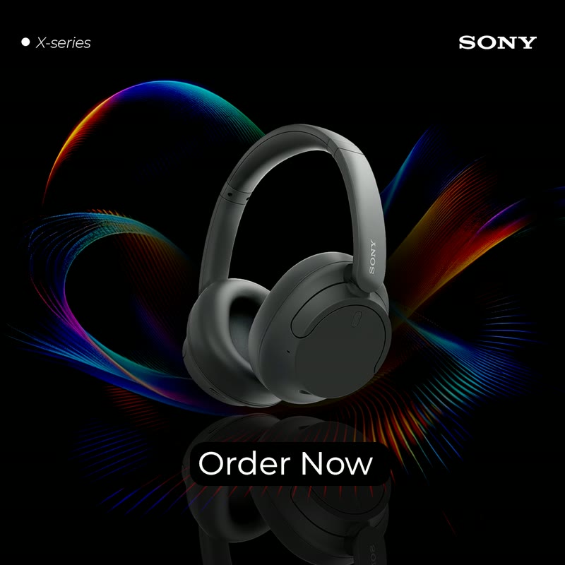 Headphone ad on black with coloured light trails.